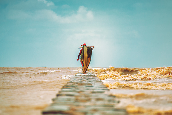 Fisherman Walking on Jetty